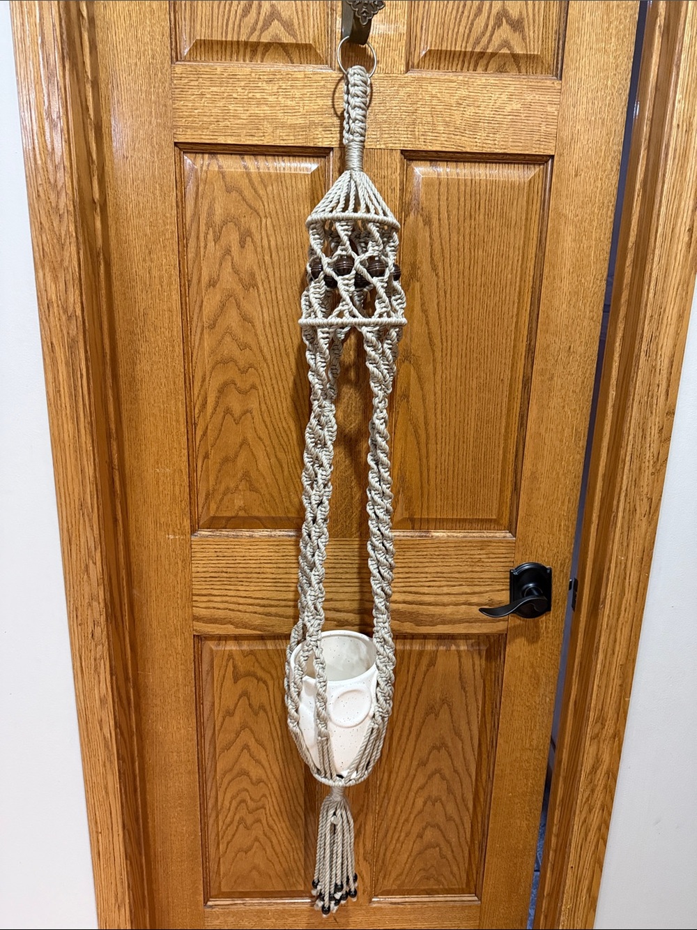 Macrame plant hanger.  Pot not included